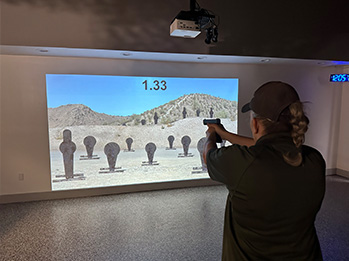 Shooting Simulator Screen and Women Shooting